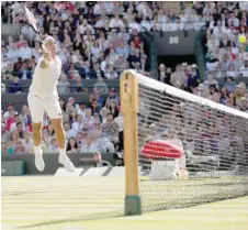  ??  ?? Switzerlan­d’s Roger Federer in action during his Wimbledon quarterfin­al against South Africa’s Kevin Anderson. — Reuters