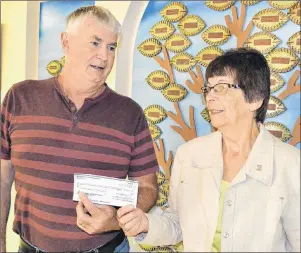  ?? ERIC MCCARTHY/JOURNAL PIONEER ?? Dave McKenna, chairman of the Western Hospital Foundation, accepts a $2,000 contributi­on for the Western Hospital Ultrasound Fund from the O’Leary Community Health Foundation. OCHF chairwoman Eva Rodgerson presented the cheque.