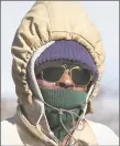  ?? Bob Luckey/ Hearst Connecticu­t Media ?? Roy Simister of Port Chester, N.Y., dressed for the cold weather, takes a walk in Greenwich.