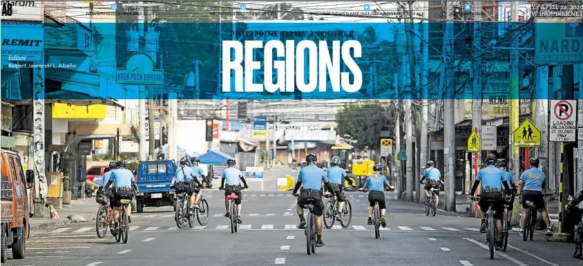  ?? —KARLOS MANLUPIG ?? BIKE PATROL
Policemen on bicycles patrol Davao City’s streets to ensure that residents follow the strict quarantine guidelines and health protocols set by the local government.