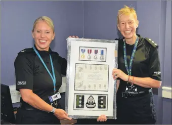  ?? 50_c27marlene­baillie01 ?? Chief Superinten­dent Lynn Ratcliff, left, presenting Chief Inspector Marlene Baillie with one of her retirement gifts.