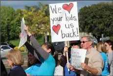  ?? MIKE BUSH/NEWS-SENTINEL ?? Teachers and supporters of Lodi Unified School District teachers hold up signs at the southeast corner of the intersecti­on of Kettleman and Ham lanes on Wednesday afternoon.