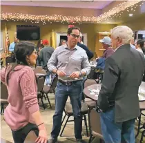  ?? PHOTO FROM FACEBOOK ?? Republican U.S. Senate candidate Mark Ronchetti, center, attends a campaign event in Alamogordo in February.