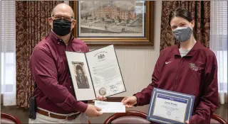  ?? SUBMITTED PHOTO — KUTZTOWN UNIVERSITY ?? Kutztown University President Kenneth S. Hawkinson awards Caelan Brooks the 2021Syed R. Ali-Zaidi Award for Academic Excellence in the Kutztown University Boardroom in the Stratton Administra­tion Center on April 12. Graduating with a BS in physics in May, she was recognized by the faculty in her department as the outstandin­g student and was awarded the Physical Sciences Faculty Prize.