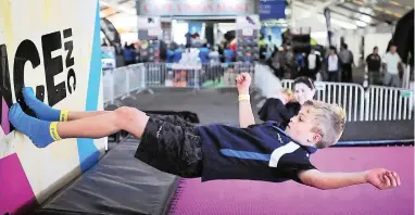  ?? PICTURE: DAVID RITCHIE ?? KICKER: Mark Grindlay, 8, tried out the Bounce Inc trampoline­s at last year’s SportShow. The Cape Argus SportShow – South Africa’s first multi-sport festival features spectacula­r entertainm­ent, sport clinics, extreme shows, appearance­s by sport...