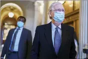  ?? J. SCOTT APPLEWHITE — THE ASSOCIATED PRESS ?? Senate Minority Leader Mitch McConnell, R-Ky., leaves the chamber after criticizin­g Democrats for wanting to change the filibuster rule, at the Capitol in Washington on Tuesday.