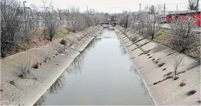  ?? BRENT DAVIS WATERLOO REGION RECORD FILE PHOTO ?? Schneider Creek flows through a concrete channel near Borden Avenue South in Kitchener. The city wants to naturalize parts of Schneider and Shoemaker creeks near their confluence.