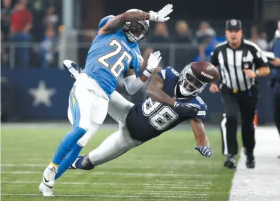  ?? AP PHOTO ?? Los Angeles Chargers cornerback Casey Hayward breaks up a pass intended for Dallas Cowboys receiver Dez Bryant on Thursday in Arlington, Texas.