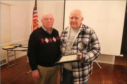  ?? LAUREN HALLIGAN — MEDIANEWS GROUP ?? Town of Malta Historian Paul Perreault, left, honors local Vietnam War veteran David Wallingfor­d, right, on Wednesday at the Saratoga County History Roundtable War Heroes Program at Brookside Museum in Ballston Spa.