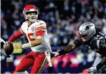  ?? JOHN SLEEZER / KANSAS CITY STAR ?? Kansas City Chiefs quarterbac­k Patrick Mahomes sets to throw an intercepti­on in the end zone under pressure from New England Patriots linebacker Dont’a Hightower during their game Oct. 14.