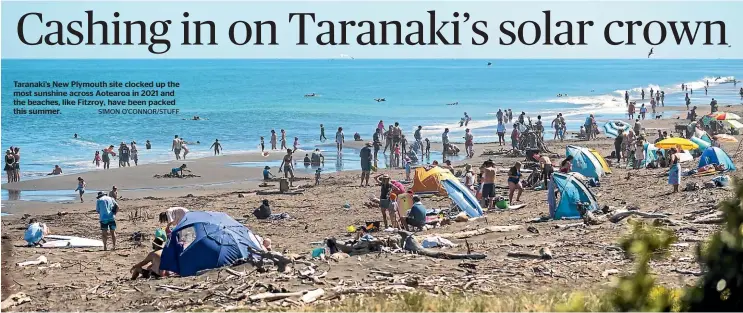  ?? SIMON O’CONNOR/STUFF ?? Taranaki’s New Plymouth site clocked up the most sunshine across Aotearoa in 2021 and the beaches, like Fitzroy, have been packed this summer.