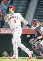  ?? Robert Gauthier Los Angeles Times ?? PUJOLS WATCHES the ball soar deep into the stands for his 599th home run during a nine-run third inning.