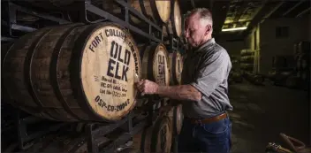  ?? COURTESY DISTILLERS SHOWCASE ?? Greg Metze of Old Elk taps a barrel of whiskey, above. Old Elk is bringing a variety of whiskeys to be sampled at the Distiller’s Showcase.