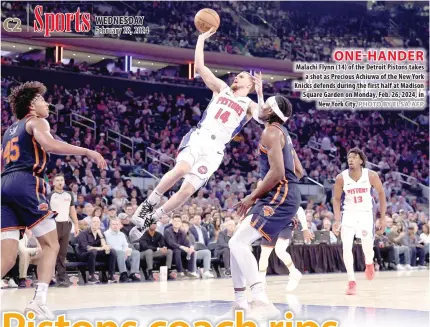  ?? PHOTO BY ELSA/AFP ?? ONE-HANDER Malachi Flynn (14) of the Detroit Pistons takes a shot as Precious Achiuwa of the New York Knicks defends during the first half at Madison Square Garden on Monday, Feb. 26, 2024, in New York City.
