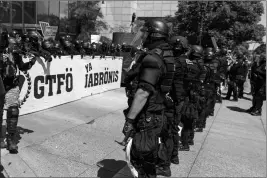  ?? ASSOCIATED PRESS ?? PORTLAND POLICE KEEP Patriot Prayer affiliates separate from antifa protesters during a rally in Portland, Ore., Saturday.