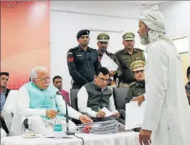  ?? HT PHOTO ?? Haryana chief minister Manohar Lal Khattar at a Janata Darbar at Salaheri village in Nuh on Friday. He handled 270 grievances.