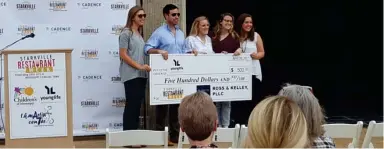  ?? Sarah Raines, SDN) (Photo by ?? Third place prize for Starkville Restaurant Week was Young Life. Silver Spoon charity sponsor Ross & Kelley, PLLC Attorneys at Law representa­tive Brian Kelley presented a $500 check to Young Life Starkville members.