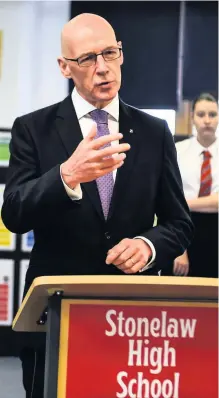  ??  ?? Cause for celebratio­n pupils on results day
John Swinney addresses Stonelaw