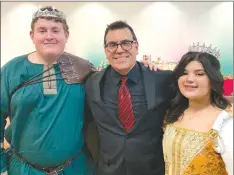  ?? Courtesy photo ?? Big Spring ISD Director of Music Gershom Garcia poses with King Benjamin Robertson and Queen Kirstyn Gusman from the Choir’s Madrigal Dinner held earlier this year.