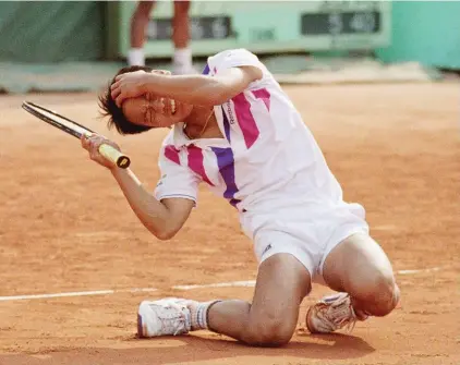  ??  ?? Left: In this June 5, 1989, file photo, Michael Chang falls to the ground crying after he defeated top-seeded Ivan Lendl at the French Open tennis championsh­ips in Paris. (AP Photo/Lionel Cironneau, File)