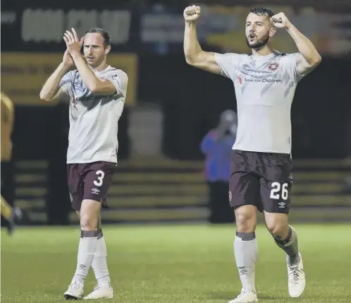  ??  ?? 0
Celebratio­ns at full-time for Aidy White and Craig Halkett as Hearts book their place in the Betfred Cup quarter-finals with a 2-1 victory.