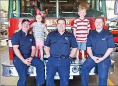  ?? STACI VANDAGRIFF/TRILAKES EDITION ?? Benton firefighte­rs, from left, Tyler Henderson, Stuart Duke and Zack Krticka pose with Katy Sue Haynie, 4, and her brother, Noah, 6, at the Benton Fire Department.