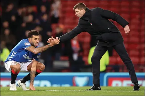  ??  ?? Steven Gerrard (right) says ring-rusty Connor Goldson may need some time out of the team to recuperate soon