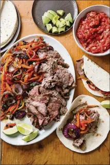  ?? JOE KELLER PHOTOS ?? Skirt steak is recommende­d for America’s Test Kitchen’s Grilled Steak Fajitas recipe, but you can substitute flank steak.