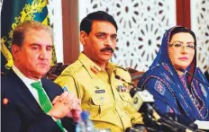  ?? AFP ?? From left: Qureshi, Ghafoor and informatio­n Minister Firdous Ashiq Awan listen to questions during a press conference at the foreign ministry in Islamabad yesterday.
