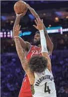  ?? AP ?? Philadelph­ia 76ers center Joel Embiid shoots over Pacers guard Duane Washington Jr. on Saturday.