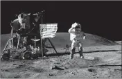  ?? ASSOCIATED PRESS ?? IN THIS APRIL 1972 photo made available by NASA, John Young salutes the U.S. flag at the Descartes landing site on the moon during the first Apollo 16 extravehic­ular activity.