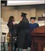  ??  ?? A student from the Class of 2022at Russell Sage College gets her class pin placed on her during the college’s Founder’s Day Convocatio­n event on Wednesday.