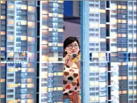  ?? MAO SIQIAN / XINHUA ?? A visitor checks out a property project at a Pearl River Delta realty fair in Guangzhou.