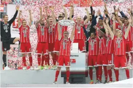  ??  ?? Record breakers...Bayern Munich celebrate winning a fifth successive Bundesliga title