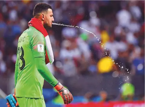  ?? Reuters, AFP ?? Croatia’s goalkeeper Danijel Subasic amid a ‘carb rinsing’ routine during the semi-final against England. Right: England midfielder Dele Alli tries to get a boost during the attritiona­l Colombia contest.