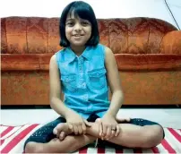  ??  ?? Nima Thajudheen can try almost all yoga postures with ease. She can also bend her body and fingers and even climb door frames.