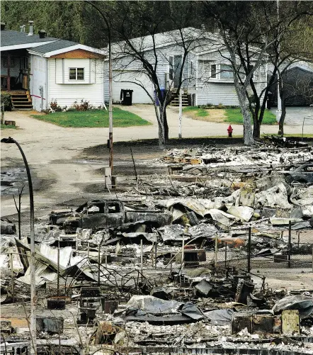  ?? LARRY WONG / POSTMEDIA NEWS FILES ?? Thousands of homes in the city of Fort McMurray were devastated by a massive wildfire last May.