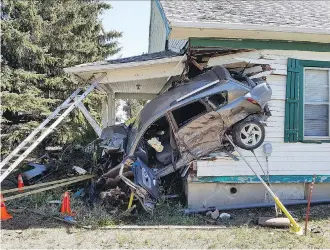  ?? RCMP/THE CANADIAN PRESS ?? RCMP in Coaldale say the family was in a different part of the home on Thursday when a car crashed into a corner of the home where a child’s bedroom was located.