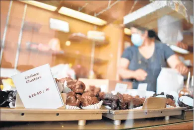  ?? JESSE WRIGHT/DAILY SOUTHTOWN PHOTOS ?? Sunday was the last day longtime employee Guadalupe Rivera would serve treats at Cupid Candies in Oak Lawn.