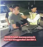  ??  ?? HEMBUS:Salah seorang pemandu diperiksa menggunaka­n alat EBA II.