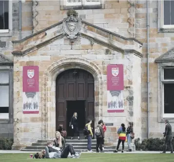  ??  ?? Frank and Beverley Macinnis, above right, flanked by Professor Vincent Janik and Professor Sally Mapstone, have pledged $10m for St Andrews University