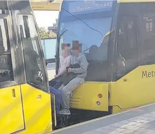  ?? TfGM ?? ●●Picture of two youngsters ‘tram surfing’ which was sent to Transport for Greater Manchester by a passenger