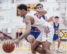  ?? ROBERTO E. ROSALES/JOURNAL ?? Valley’s Jevon Baker dribbles around Los Lunas’ Tyler Kiehne during the Vikings’ win over the Tigers Thursday.