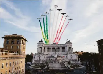  ?? Cecilia Fabiano / Associated Press ?? The Italian air force displays the national colors while flying over the “Unknown Soldier” monument during the swearing-in ceremony of President Sergio Mattarella in Rome.