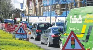  ??  ?? Temporary traffic lights are causing long delays to traffic in Hermitage Lane, Barming