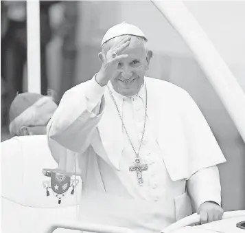  ?? DAREK DELMANOWIC­Z, EUROPEAN PRESSPHOTO AGENCY ?? Pope Francis waves to the faithful from the popemobile Wednesday as he arrives to the archbishop­s' palace in Krakow, Poland for World Youth Day celebratio­ns.