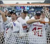  ?? ELISE AMENDOLA — THE ASSOCIATED PRESS FILE ?? Maryland players cut the net to celebrate their victory over Ohio State in the 2017 NCAA final in Foxborough, Mass., last May. Defending champion Maryland is the top seed for this year’s tournament, which starts Saturday.