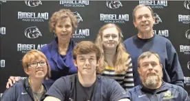  ?? Scott Herpst ?? Ridgeland senior tight end Kendall Barrett signed papers to continue his football career at Reinhardt University last week. Also on hand for the signing ceremony was Amy Barrett, Brad Barrett, Sandra Shields, Kaylee Barrett and Ron Shields.