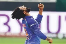  ?? Virendra Saklani/Gulf News ?? India’s Ravindra Jadeja celebrates after taking his third wicket during the match against Bangladesh on Wednesday.