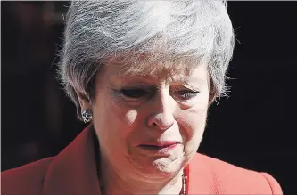 ?? LEON NEAL GETTY IMAGES ?? The face of defeat: Standing outside 10 Downing St. in London, British Prime Minister Theresa May announces that she will resign on Friday, June 7.